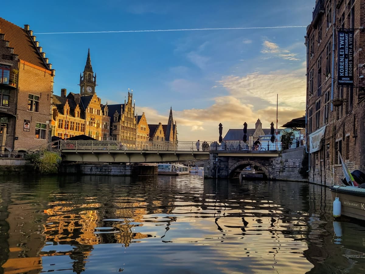 The Graslei in Ghent at golden hour - stepped gables reflected in the canal